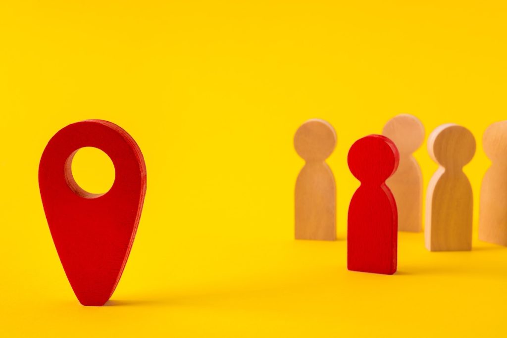 Faceless figures of people gathering community searching new address using web app traveling, abroad isolated over bright vivid shine vibrant yellow color background, affordable housing analytics