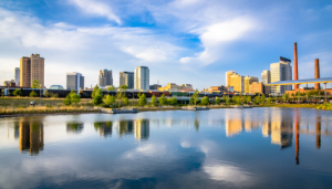 Skyline shot of Birmingham, Alabama looking across the pond located at Railroad Park. This article refers to the city's Renter's Market.