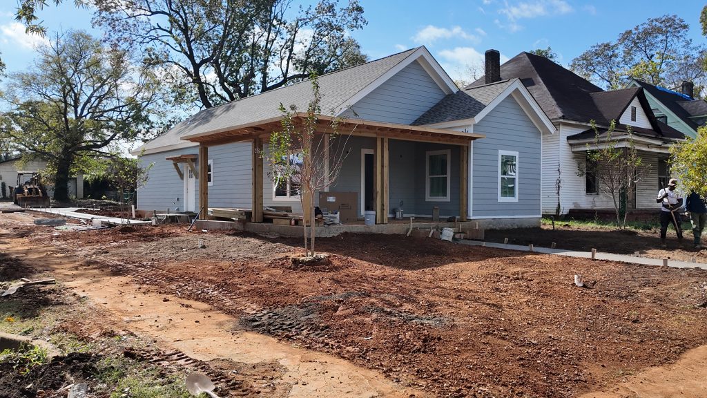 Gray Fortis Home with porch in Woodlawn Neighborhood before landscaping has begun.JPG