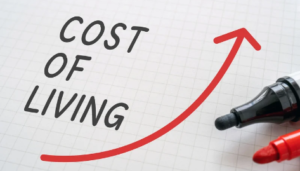 2027 COLA: Cost of living written out with an increasing arrow in red.