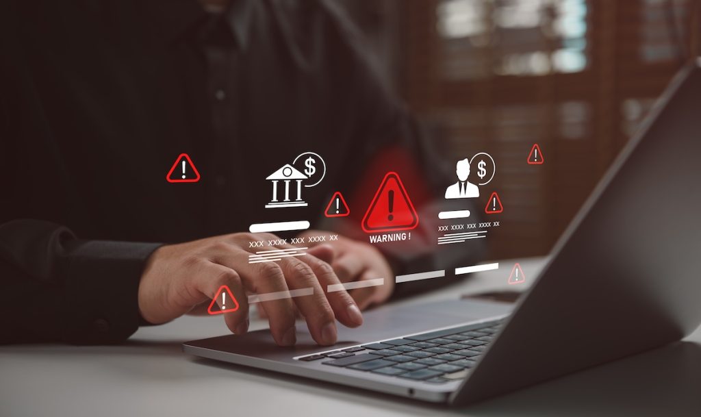 Businessman with financial warning icons and alert symbols, cybersecurity risk and fraud detection concept, HUD audit fraud risk
