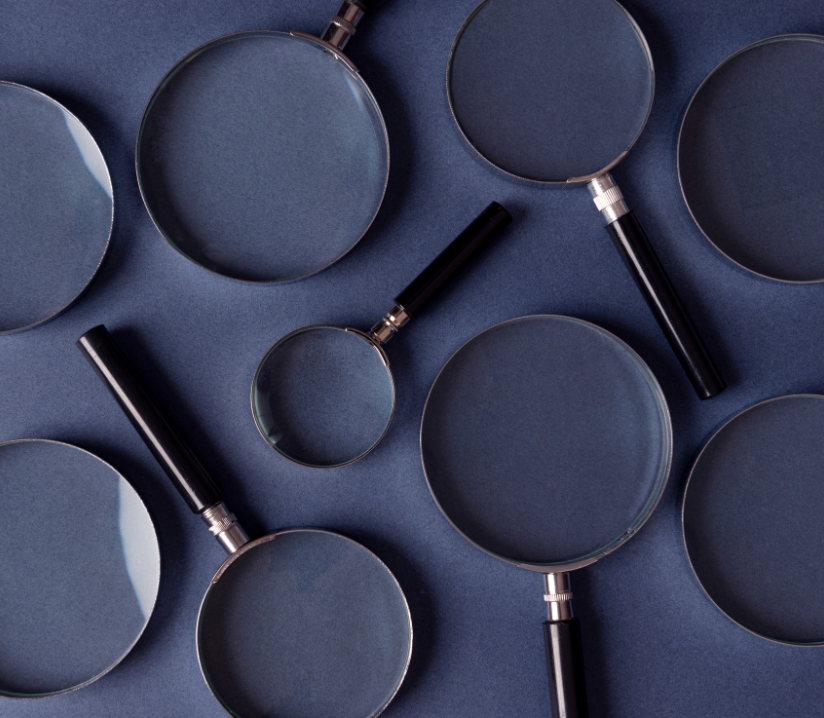 pbca quality control, magnifying glasses on a dark blue background