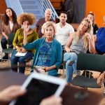 Woman Asking Question at Group Neighborhood Meeting in Community, HUD Tenant Empowerment Grants